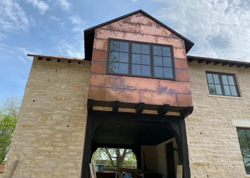 Copper metal panel facade on a stone building for Roof Repair in East Bakersfield