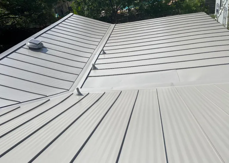 Solar attic fan installed on a metal roof for Roof Ventilation in East Bakersfield